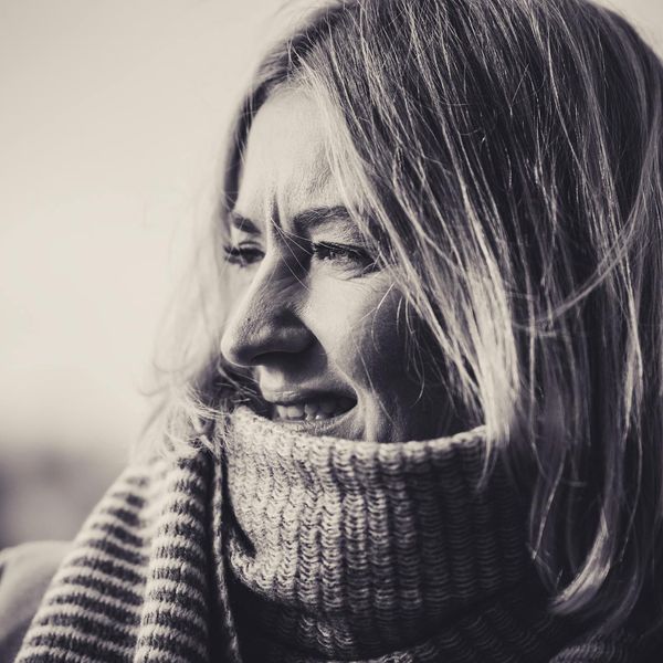 Person smiling and feeling energized outdoors